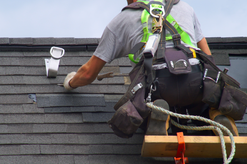 Freedom Exteriors roofing contractor at work